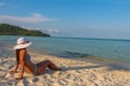 A female asian model relaxing in the sun on Sao Beach, Phu Quoc, Vietnam