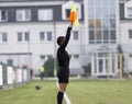 Female assistant refere in action during football