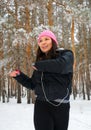 A female athlete does gymnastics outdoors in winter
