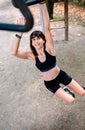 Woman doing monkey exercises on rings Royalty Free Stock Photo