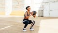 Female athlete doing squat exercises Royalty Free Stock Photo