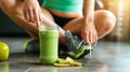 Female athlete drinking healthy organic detox kale and avocado smoothie after exercise