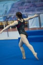 Female athlete gymnast performing at the stadium