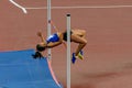 female athlete high jump side view in summer athletics