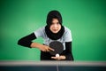 female athlete in hijab preparing to serve Royalty Free Stock Photo