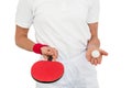 Female athlete holding table tennis paddle and ball Royalty Free Stock Photo