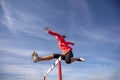 Female athlete jumping above the hurdle during the race Royalty Free Stock Photo