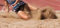 Female athlete long jump landing Royalty Free Stock Photo