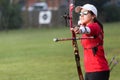 Female athlete practicing archery in stadium Royalty Free Stock Photo