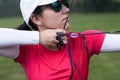 Female athlete practicing archery in stadium Royalty Free Stock Photo