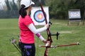 Female athlete practicing archery in stadium Royalty Free Stock Photo