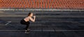 Female athlete preparing legs for cardio workout. Fitness runner doing warm-up routine. woman runner warm up outdoor. athlete Royalty Free Stock Photo