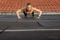 Female athlete preparing legs for cardio workout. Fitness runner doing warm-up routine. woman runner warm up outdoor. athlete Royalty Free Stock Photo