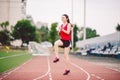 Female athlete preparing legs for cardio workout. Fitness runner doing warm-up routine. woman runner warm up outdoor Royalty Free Stock Photo