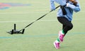 Female athlete pulling a weighted sled Royalty Free Stock Photo