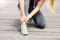 Female athlete runner touching foot in pain outdoors Royalty Free Stock Photo