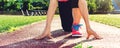 Female athlete on the starting line of a stadium track Royalty Free Stock Photo