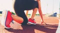 Female athlete on the starting line of a stadium track Royalty Free Stock Photo