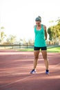 Female athlete stretching on a running track Royalty Free Stock Photo