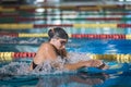 Female athlete swimming in breaststroke style in the pool lane Royalty Free Stock Photo
