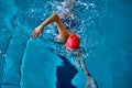 Female athlete swimming fast in crawl style. Royalty Free Stock Photo