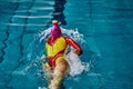 Female athlete swimming fast in crawl style. Royalty Free Stock Photo