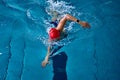 Female athlete swimming fast in crawl style. Royalty Free Stock Photo