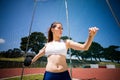 Female athlete about to throw a discus Royalty Free Stock Photo