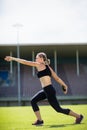 Female athlete about to throw a discus Royalty Free Stock Photo