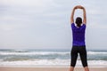 Female athlete warming up and stretching the upper body Royalty Free Stock Photo