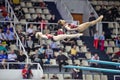 Female athletes perform exercise on syncronized springboard diving