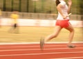 Female athletes running on the track