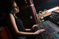 Female audio engineer using sound mixer Royalty Free Stock Photo