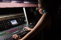 Female audio engineer using sound mixer Royalty Free Stock Photo