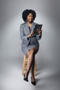 Female Author or Businesswoman Keynote Speaker with Tablet