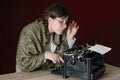 Female author typing on an old typewriter Royalty Free Stock Photo