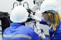 female automation machine engineer student study and inspection control robot arm machine in university or factory workshop. ai