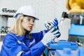 female automation machine engineer student study and inspection control robot arm machine in university or factory workshop. ai