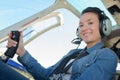 Female aviator in cockpit