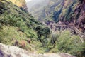 Female backpacker climbing with backpack in Himalayas, Nepal