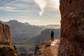 Female Backpacker Stands on the Edge of the South Kaibab Trail