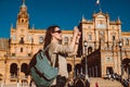 Female backpacker visits Seville, Spain. European backpacking adventure