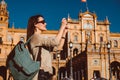 Female backpacker visits Seville, Spain. European backpacking adventure