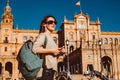 Female backpacker visits Seville, Spain. European backpacking adventure