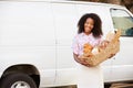 Female Baker Delivering Bread Standing In Front Of Van Royalty Free Stock Photo