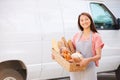 Female Baker Delivering Bread Standing In Front Of Van Royalty Free Stock Photo