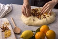 Female baker hands making dough for a homemade sweet bread Royalty Free Stock Photo