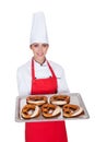 Female Baker Holding Fresh Bavarian Pretzel Royalty Free Stock Photo