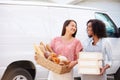 Female Bakers With Bread And Cakes Standing In Front Of Van Royalty Free Stock Photo