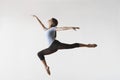 Female Ballet Dancer Leaping In Mid Air